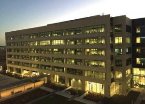 Figure 2: Functional testing of automated window shades is shown at night. The sequence of operation calls for shades to close after dusk. Here, all shades are open at night. The photograph has been lightened to highlight shade position. All graphics cou